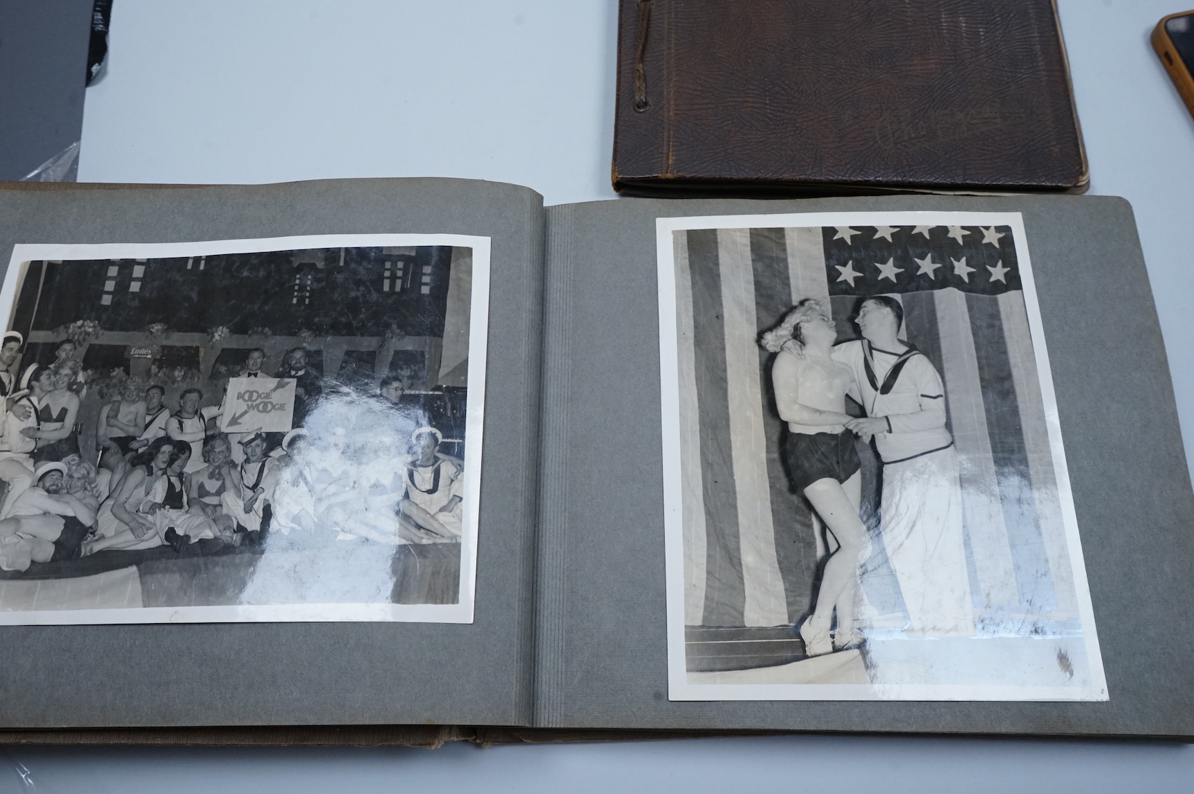 Two WWII naval photo albums, containing an archive of 1940s photographs of the Russian convoy in the Barents Sea, a ship’s concert at Scarpa Flow, a variety of Royal Naval vessels and some aircraft, images aboard HMS Peg